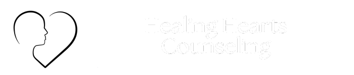 Outline of heart with profile of face in black with words Healing Hearts Counseling in white on transparent background. The logo of healing hearts counseling