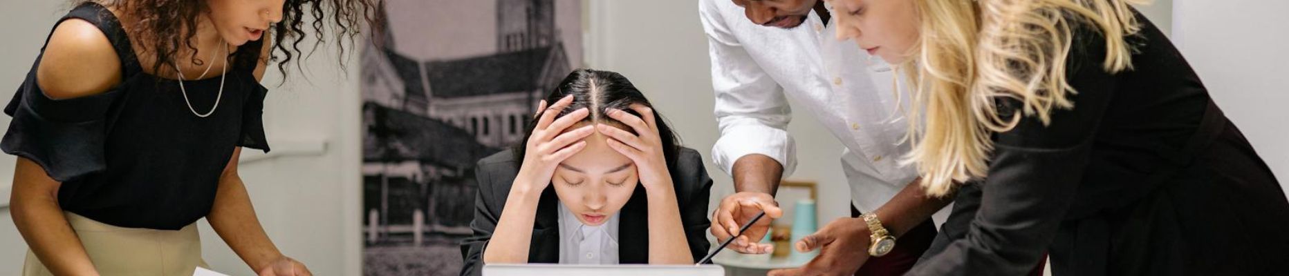 Women feeling overwhelmed at work for blog on Managing Stress at Work.