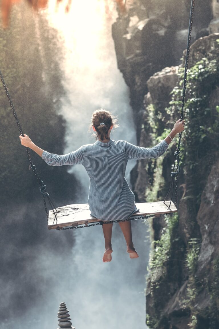 Photo by Artem Beliaikin Woman riding on wooden swing for treatment for trauma webpage using EMDR Therapy in Maryland, Nevada and South Carolina.