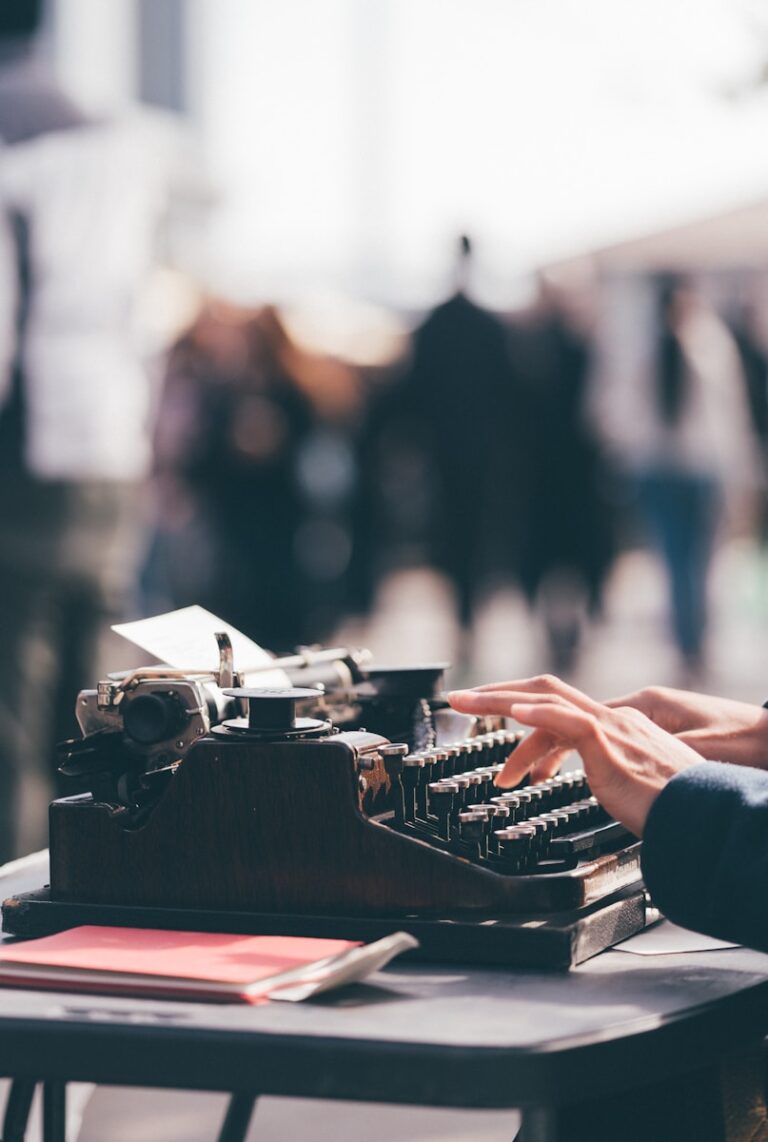 woman using typewriter symbolizing learning, growth, and recovery through therapy
