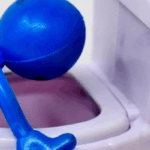 Blue toy figure hovering over toilet representing emetophobia